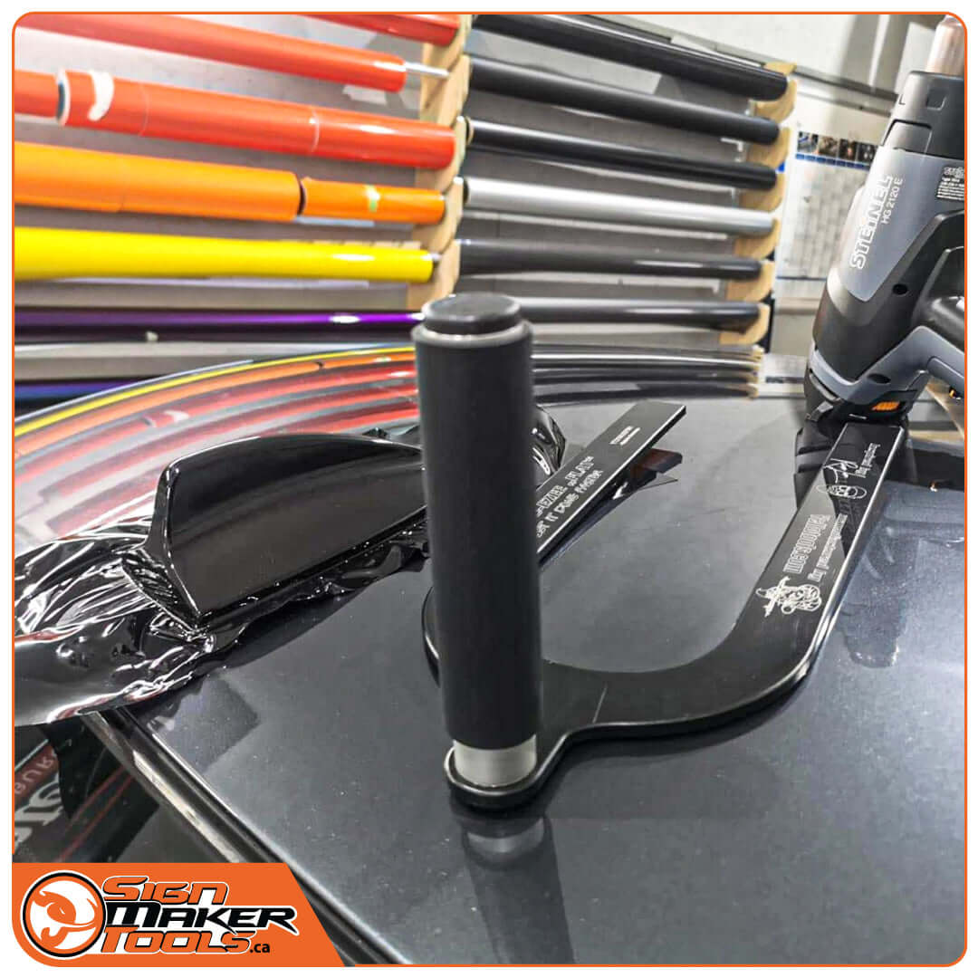 Wrap-U-Ezee Flat wrapping aid used on a shark fin antenna for smooth film application
