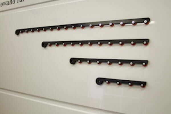 Four lengths of Black Mamba magnetic chains displayed on a white background