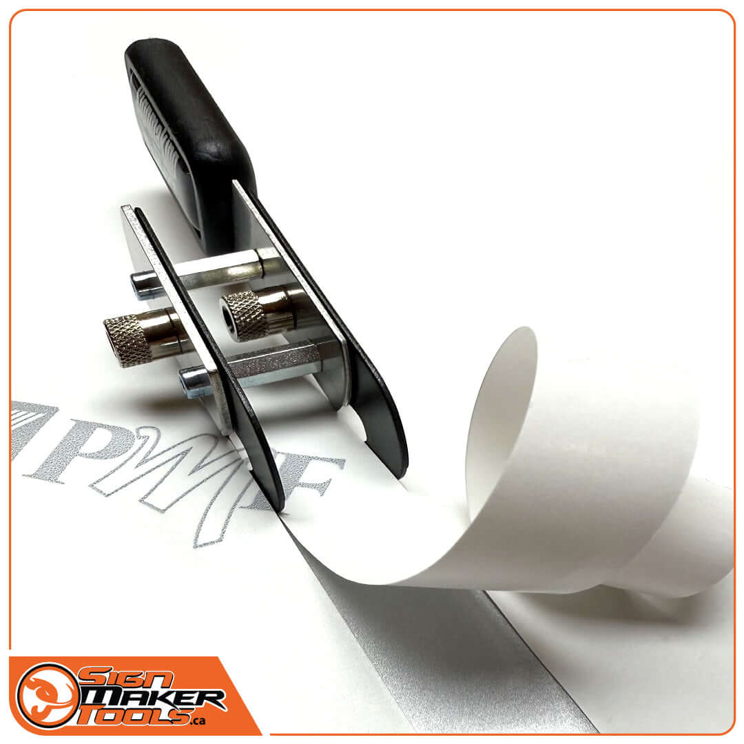 BodyGuardKnife Twin Teflon making a precise center cut in backing paper