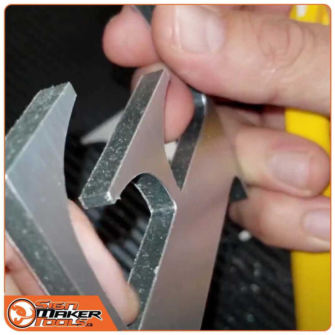 Deburring the edge of a metal letter with the CeraSwitch knife