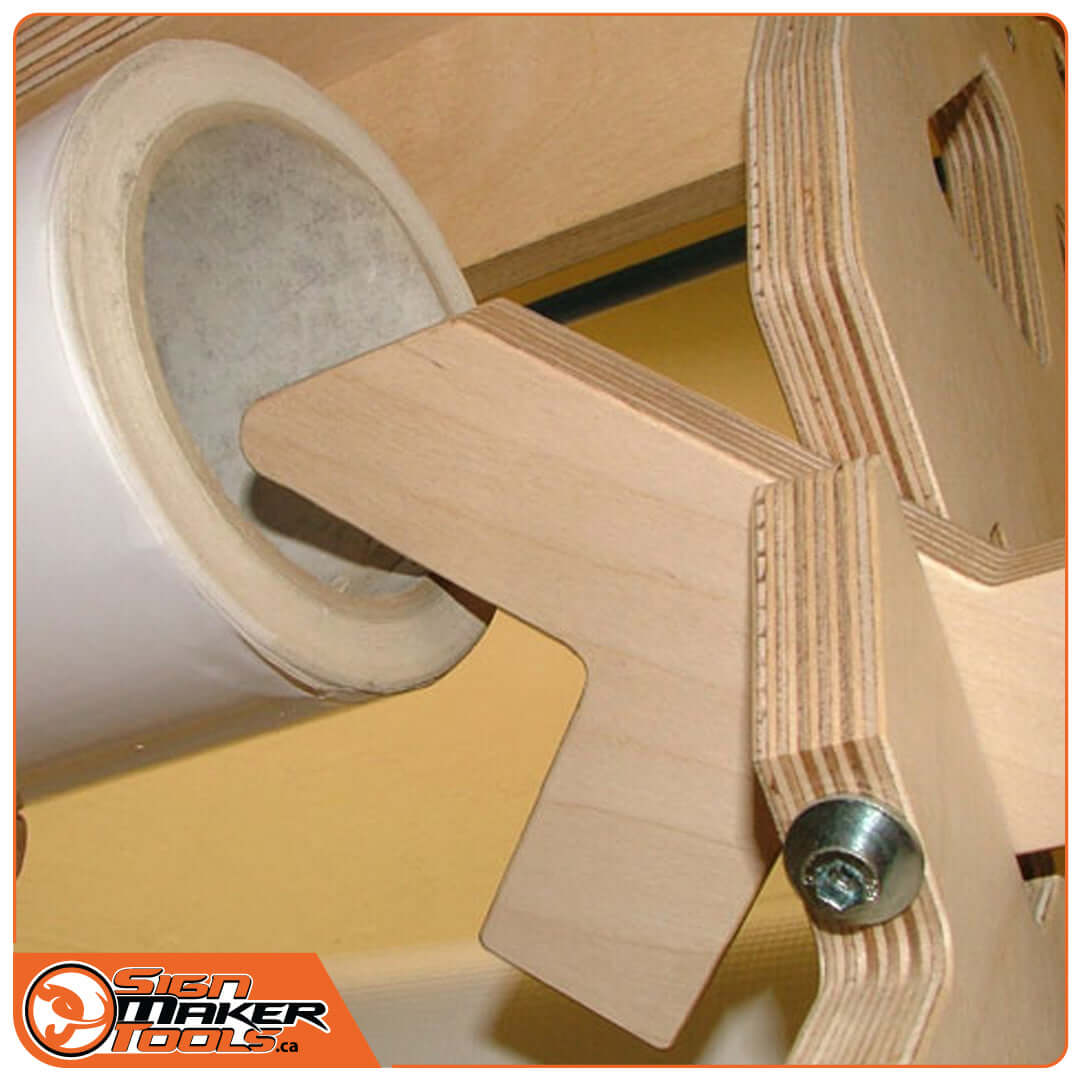 Close-up of vinyl roll being loaded onto TreeMAXX EasyReach PRO's custom wooden peg mechanism
