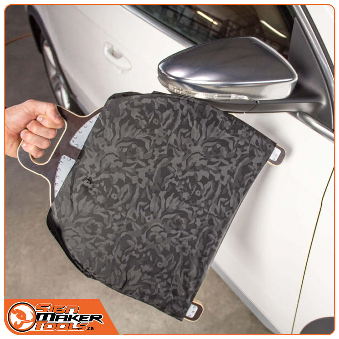 Using Wrap-U-Ezee tool to wrap vinyl around a vehicle mirror