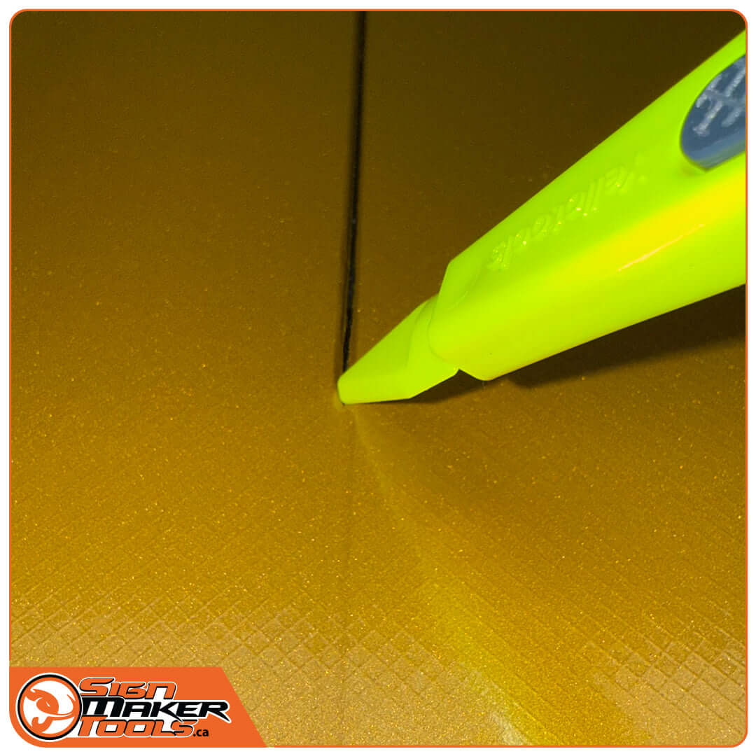 Round head of GoliaCut Stick slicing vinyl along a narrow gap