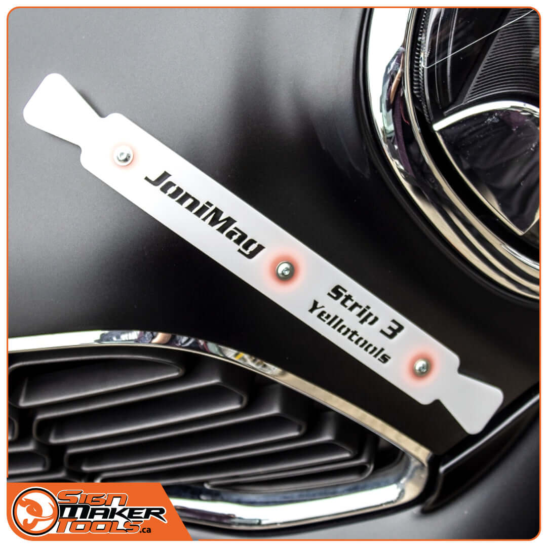 JoniMag Strip 3 magnetically attached to a car's front grille