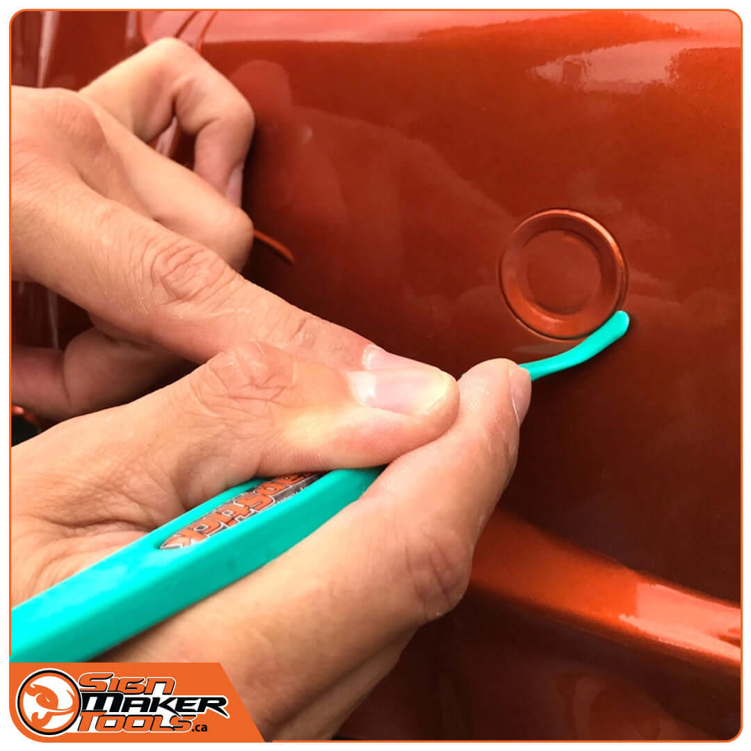 Applying vinyl with WrapStick Flex tool for precision near trim and edges