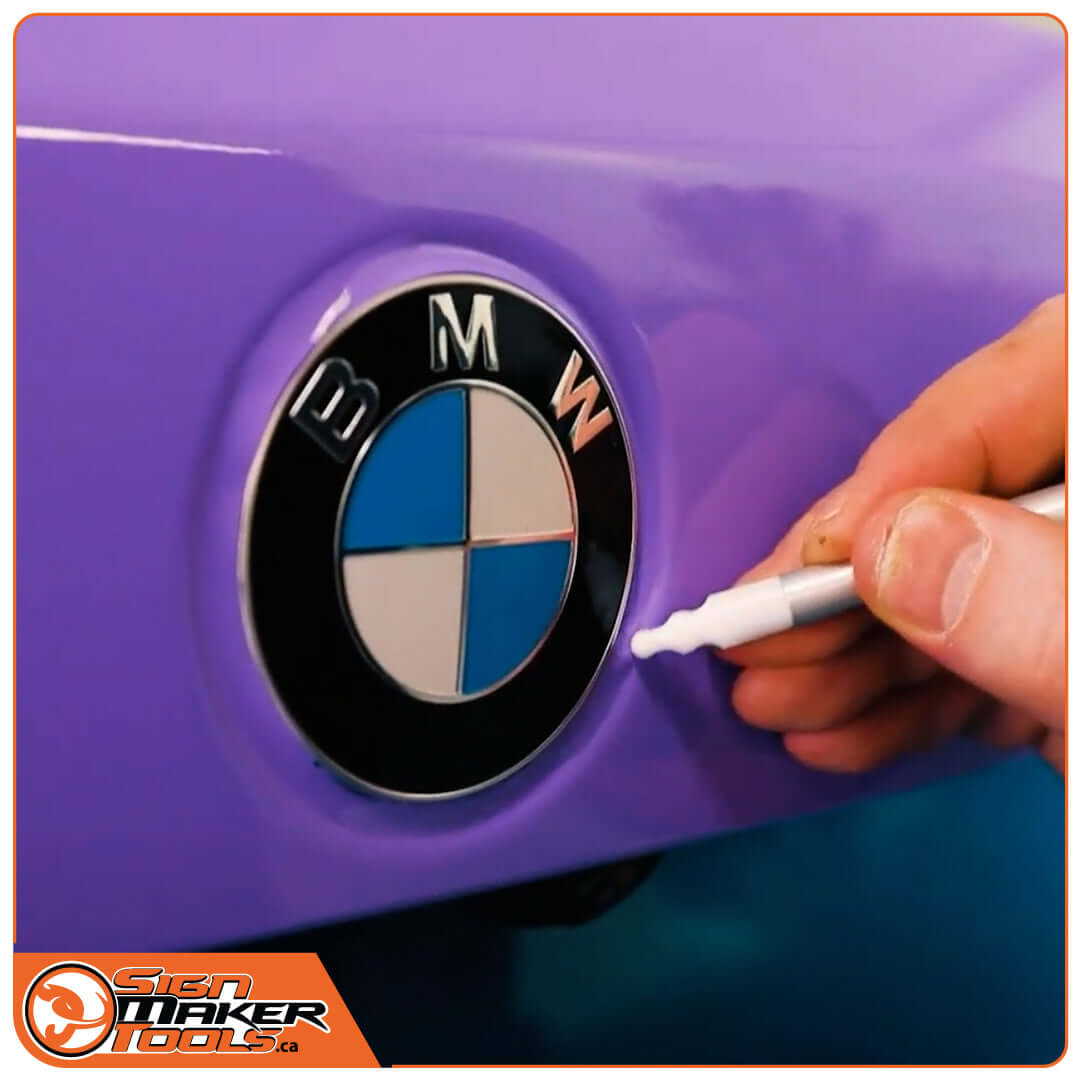 Precision detailing near car emblem using Lucky FlipperPen Duo tool