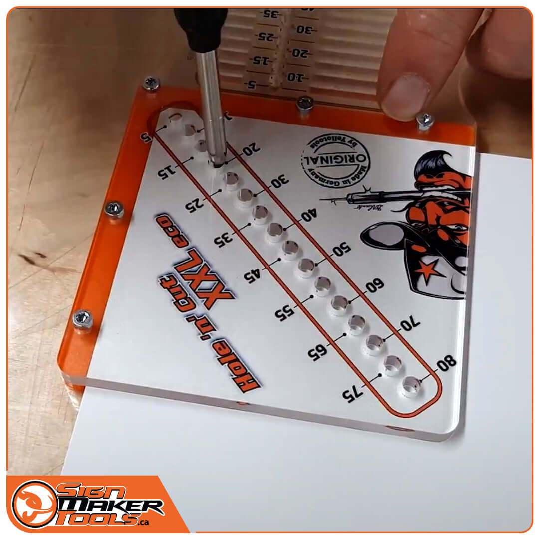 Drilling holes precisely on a sign using the Hole 'n' Cut XXL Eco template