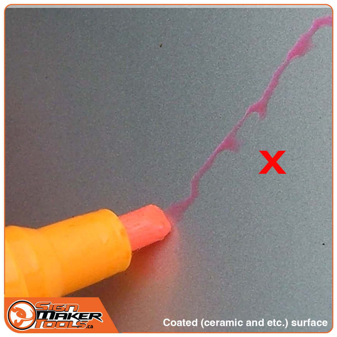 Testing pen on coated surface showing poor adhesion with a red X