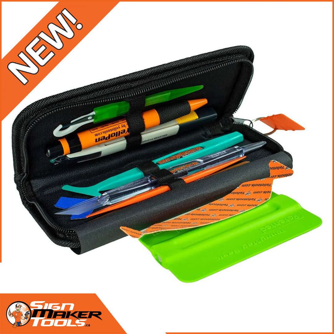 Open black tool case with various professional sign making tools and accessories