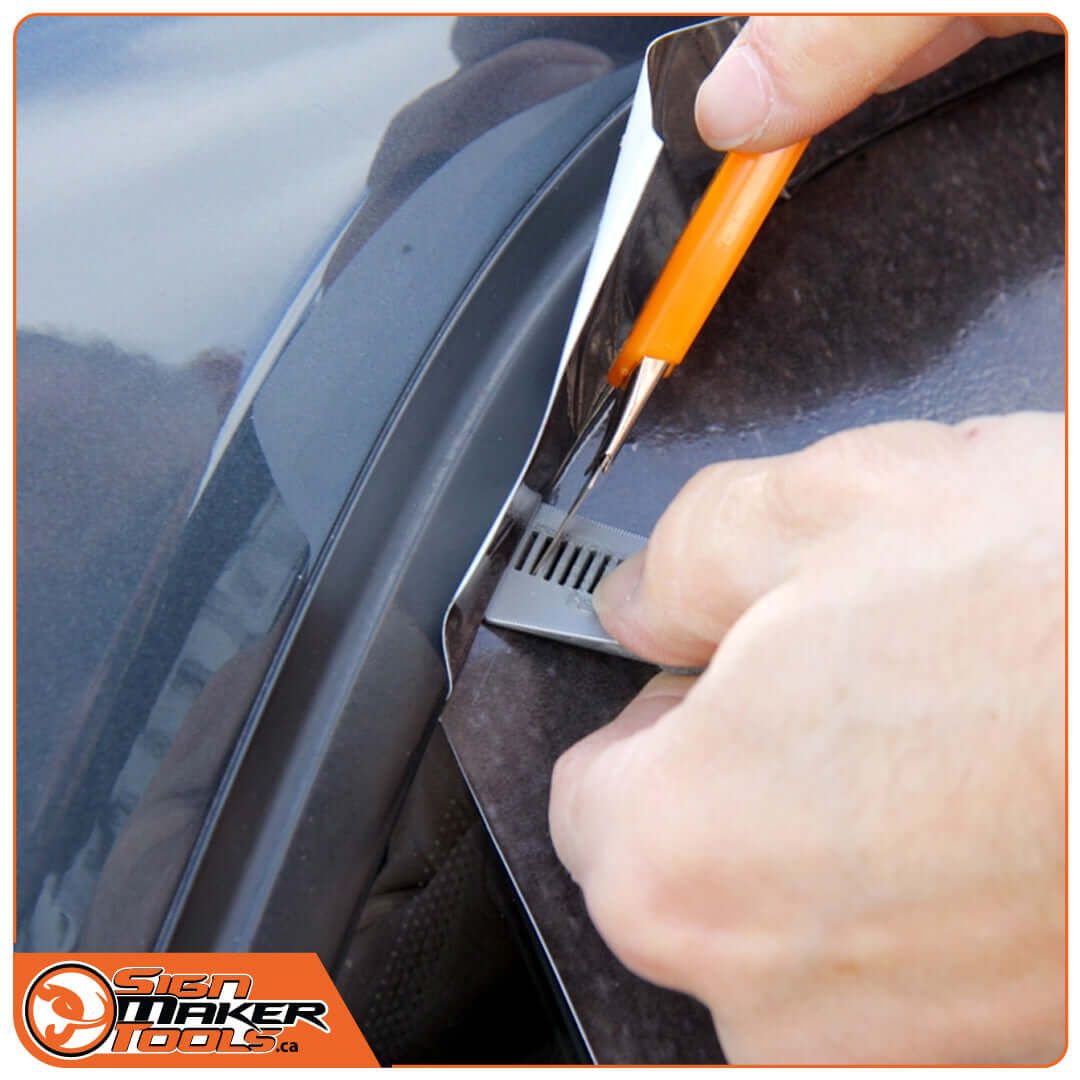 SlipCut MINI in use for precise trimming during car vinyl installation