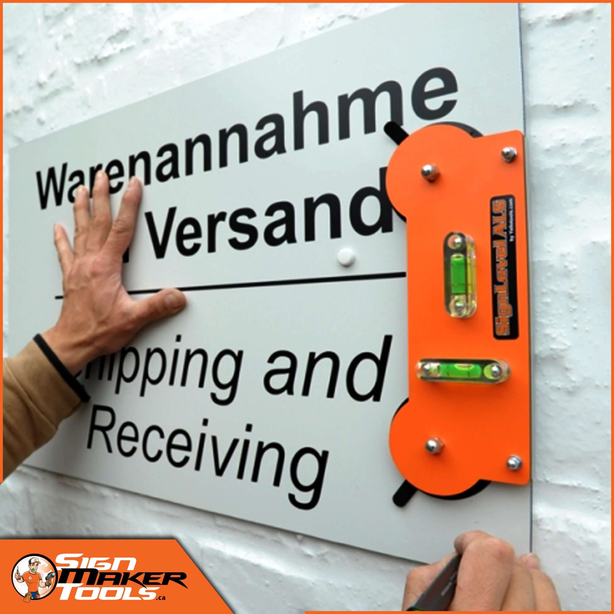 SignLevel ALS suction cup tool being used to mount a sign accurately