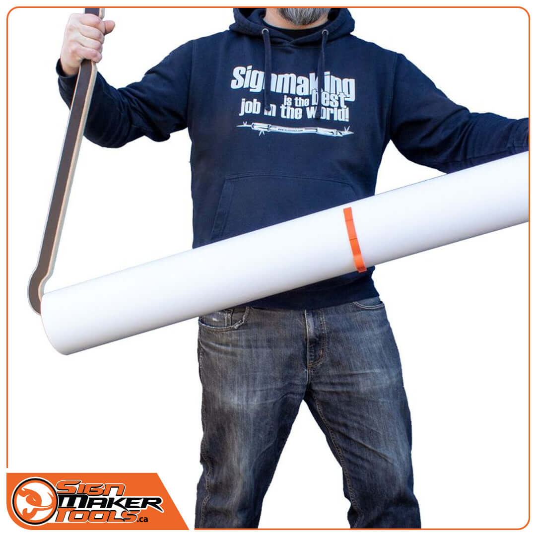 TimStick lifting aid being used to carry a large vinyl film roll with ease