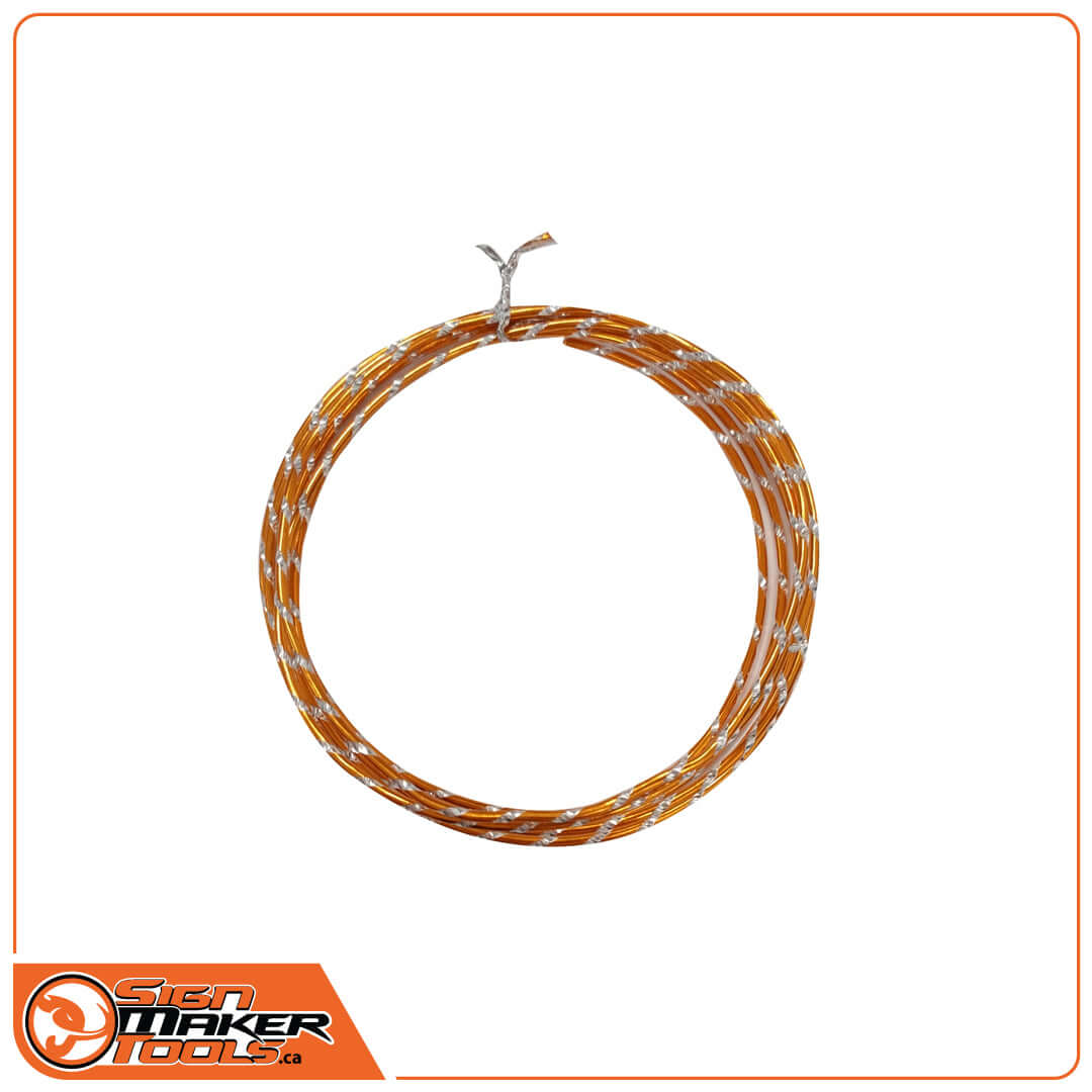 Coiled orange and silver flexible WrapBend-it contour wire on white background