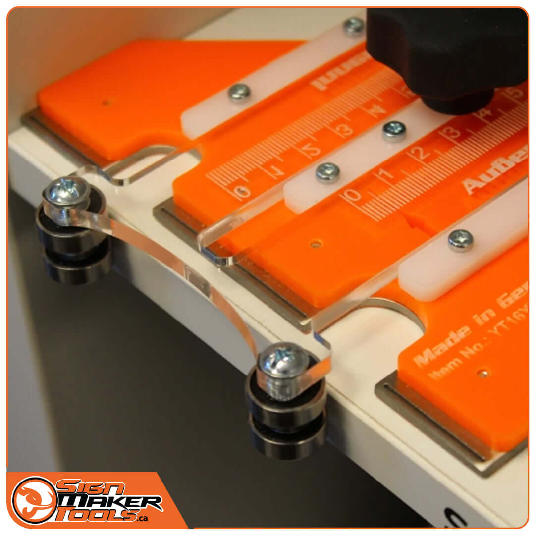 YelloSlip Cut tool positioned on sign material showing roller and measurement details