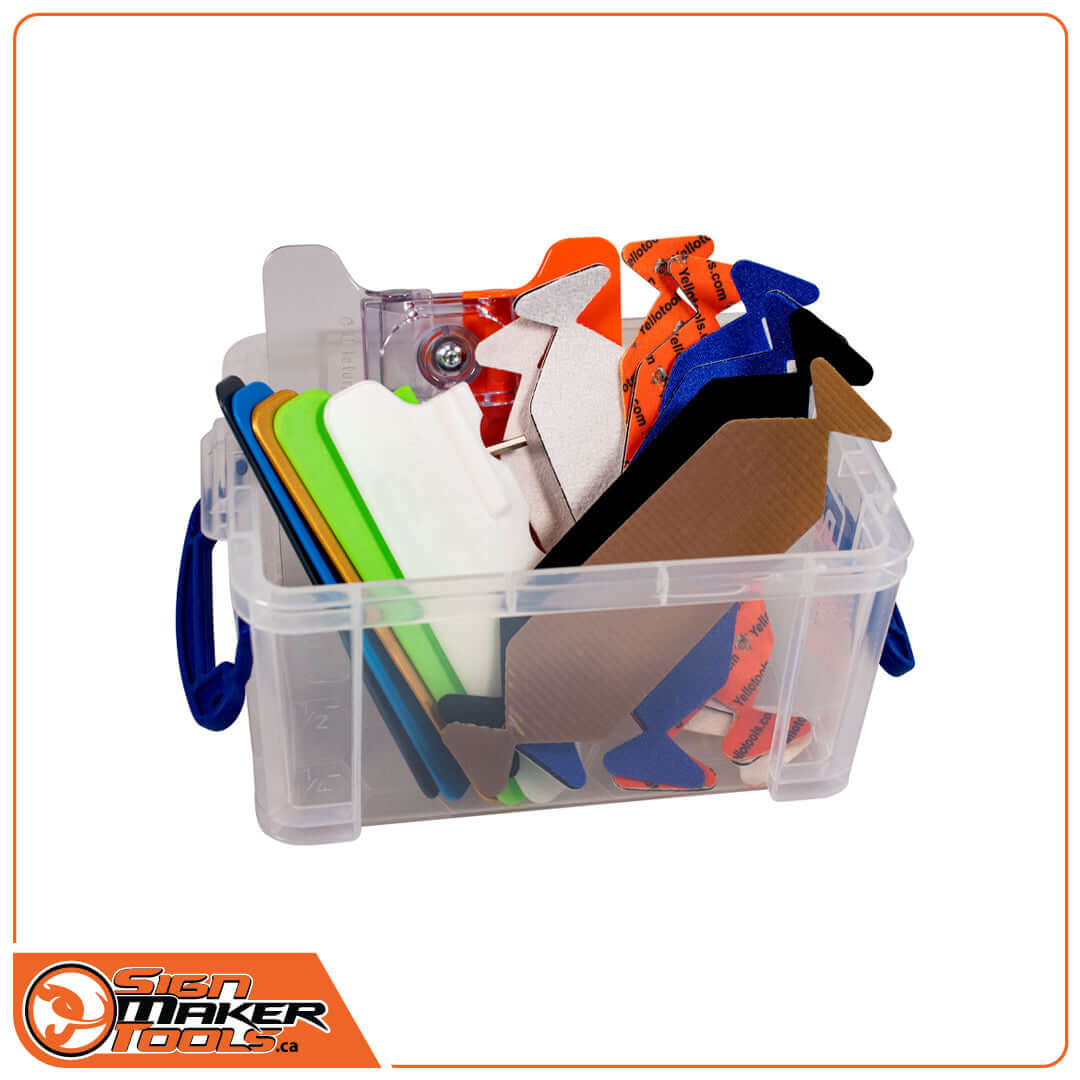 Assorted YelloTwin squeegee tips and handles neatly packed in a transparent storage box