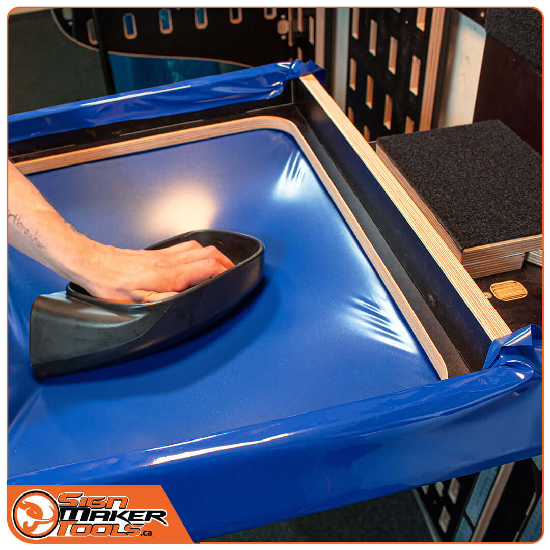 Using the Wrap-U-Ezee frame to wrap a car part with blue film