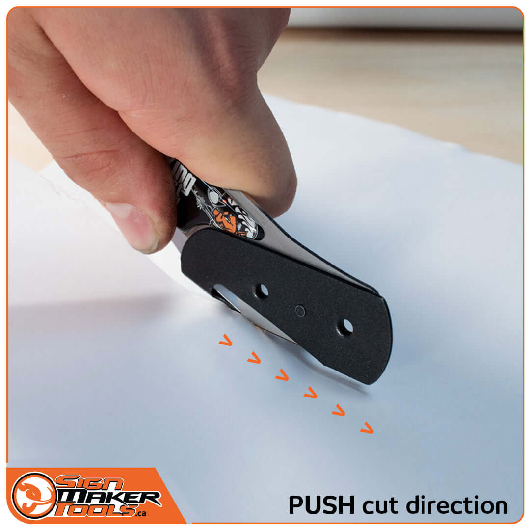 BodyGuardKnife EVO making a push cut on white liner paper