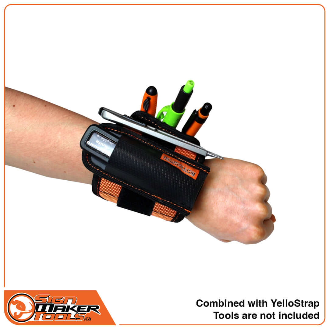 YelloGear Flex Plate attached to a YelloStrap Pro wristband and loaded with various tools