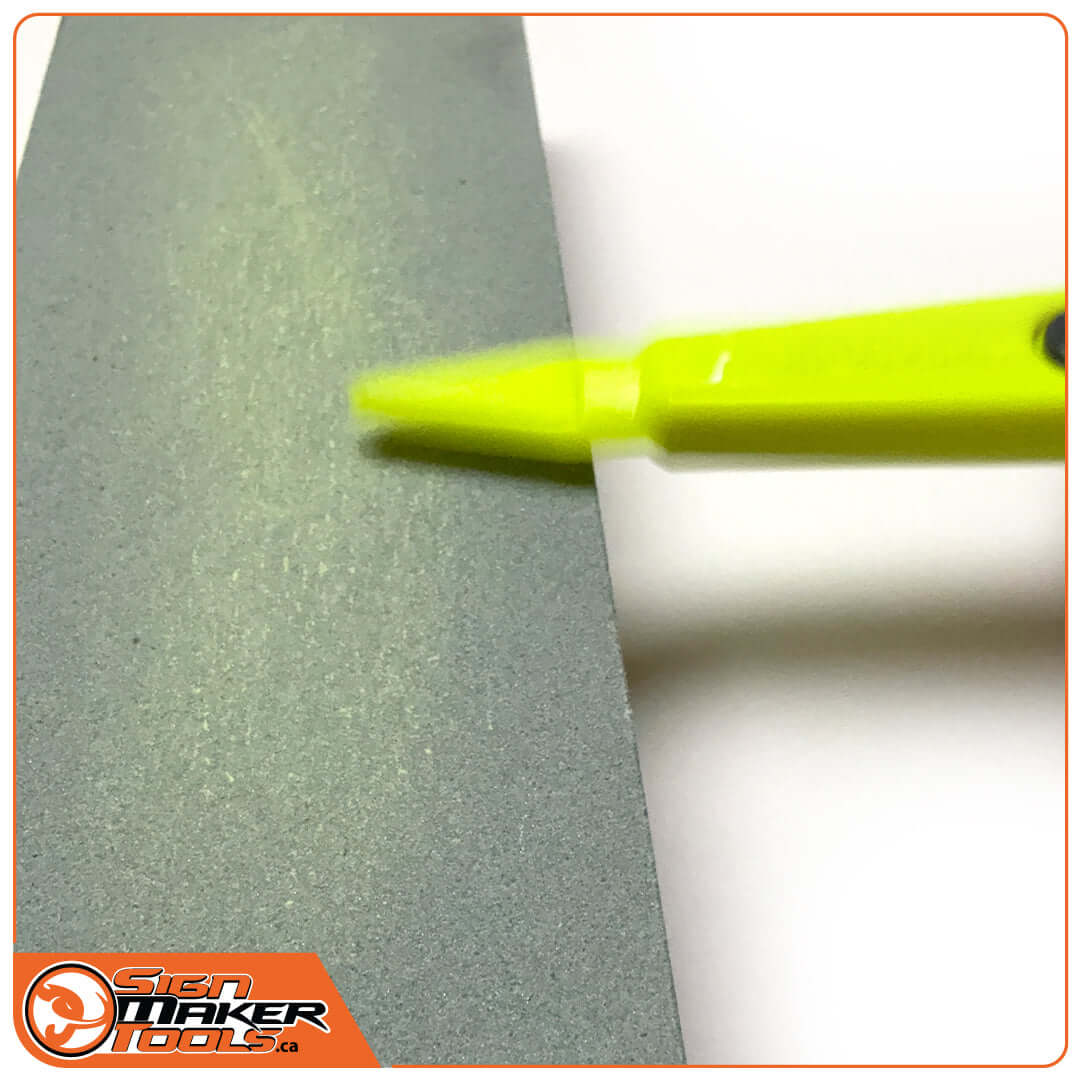 V-shaped head of GoliaCut Stick being resharpened on a sharpening stone