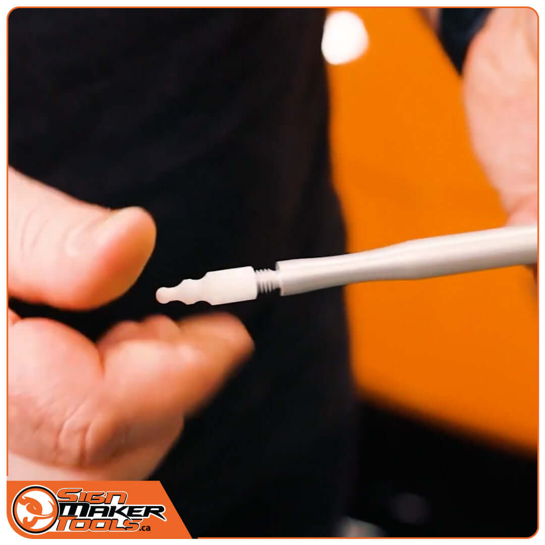 Hand showing interchangeable tip on Lucky FlipperPen Duo for car wrapping