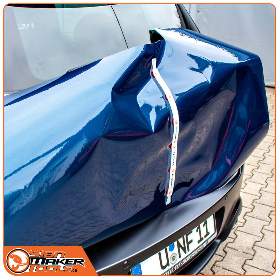 JoniMag magnetic stripe holding vinyl wrap in place on a car's curved surface