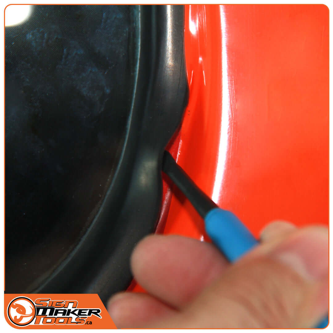 Using the LacyTip HD tool to lift a rubber seal during vinyl application