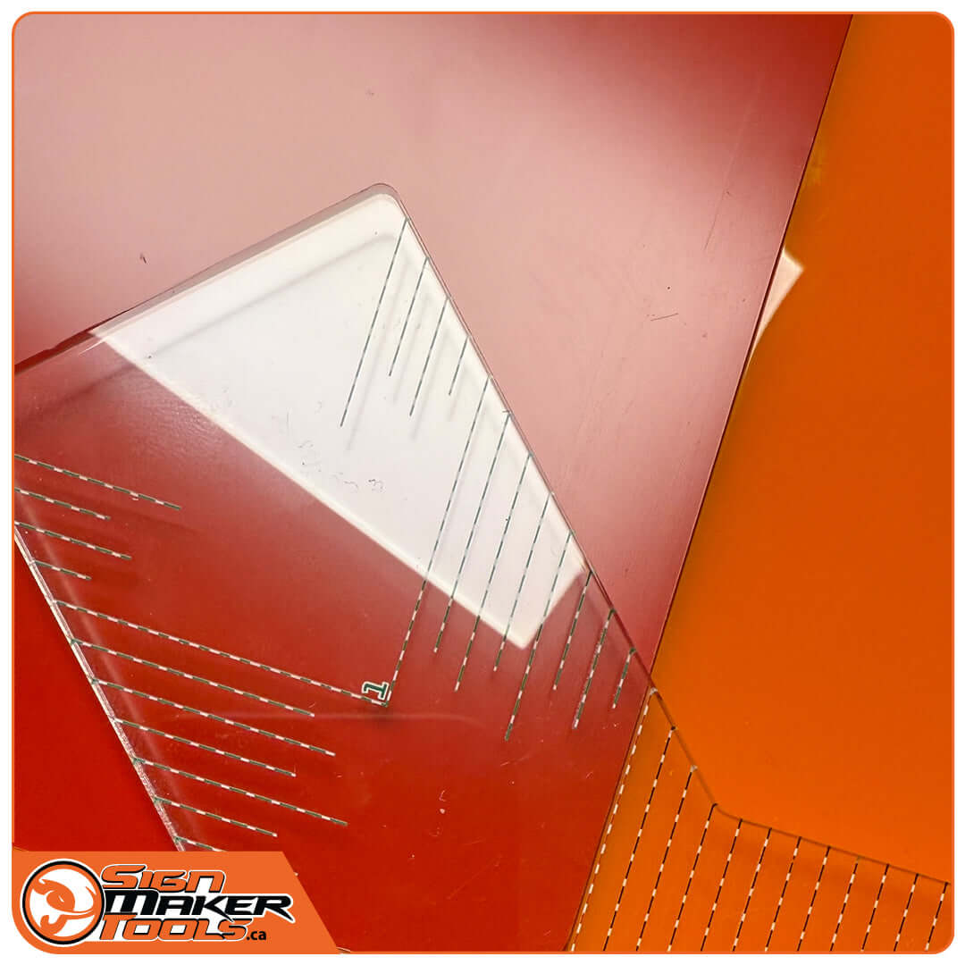 Corner of PrintJoggle tool pressed on a vinyl-covered sign