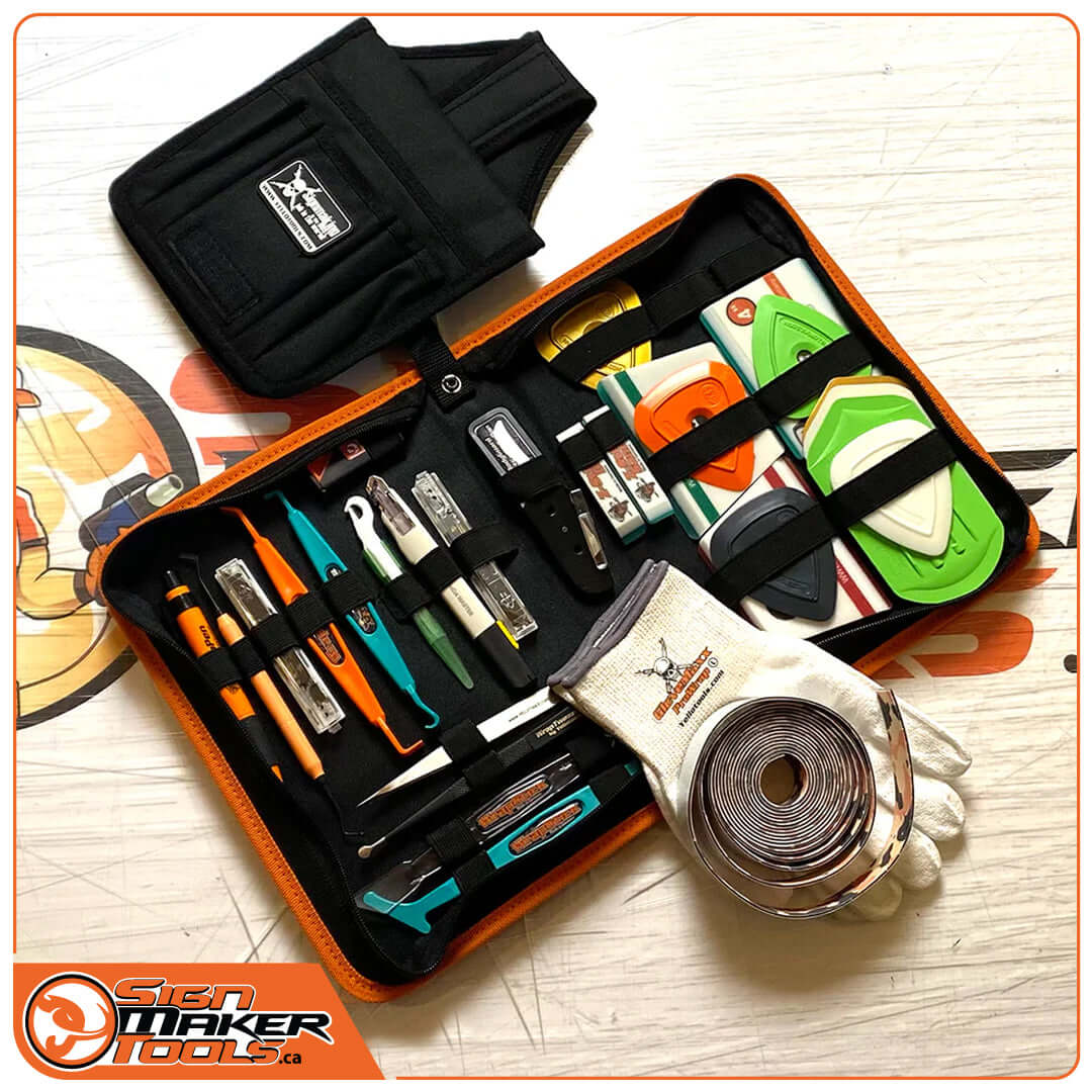 Complete professional wrap tool kit with carrying case, gloves, blades, squeegees, and various accessories.