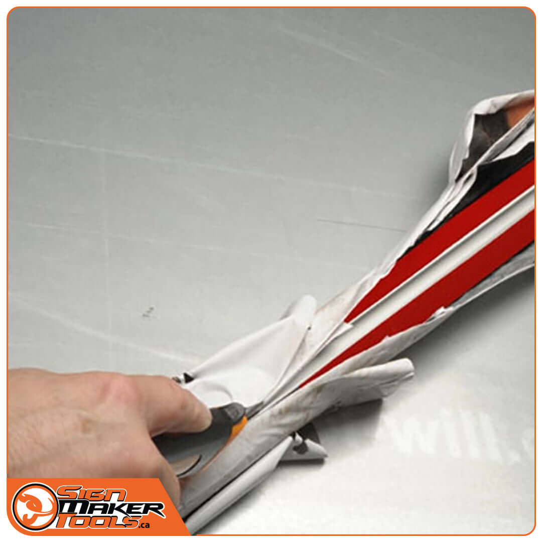 Peeling off old large vinyl print using the RapidRemover tool