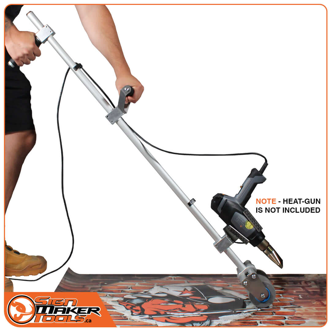 StreetRoller Flexi floor wrap roller in use with attached heat gun (heat gun not included)