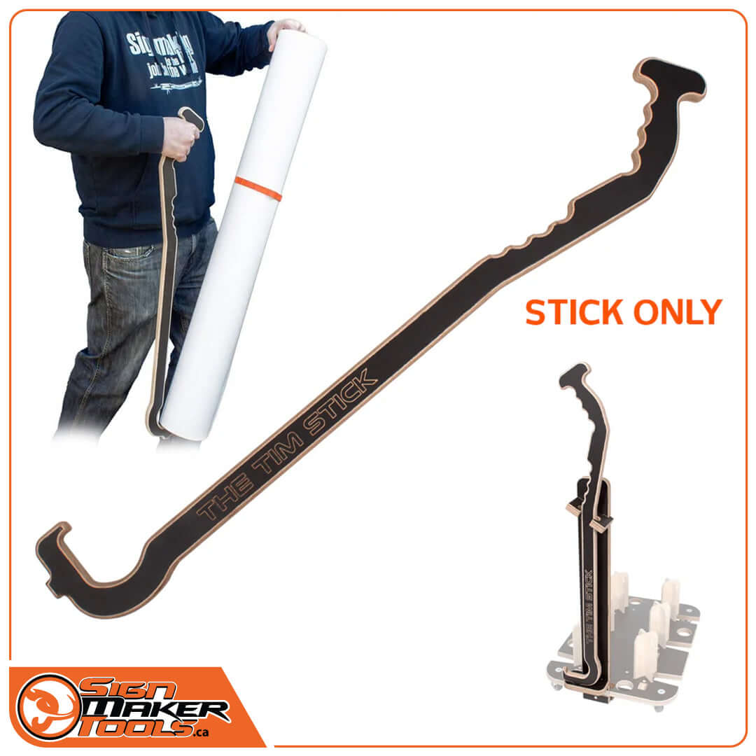 The Tim Stick vinyl roll lifting aid for sign makers, shown being used to lift a large roll of vinyl film