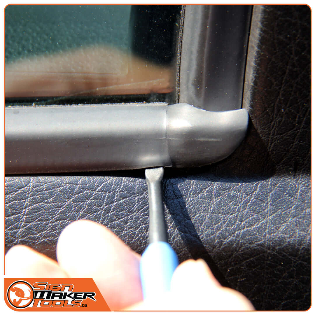 LacyTip HD Trio tool tucking material by a car window edge
