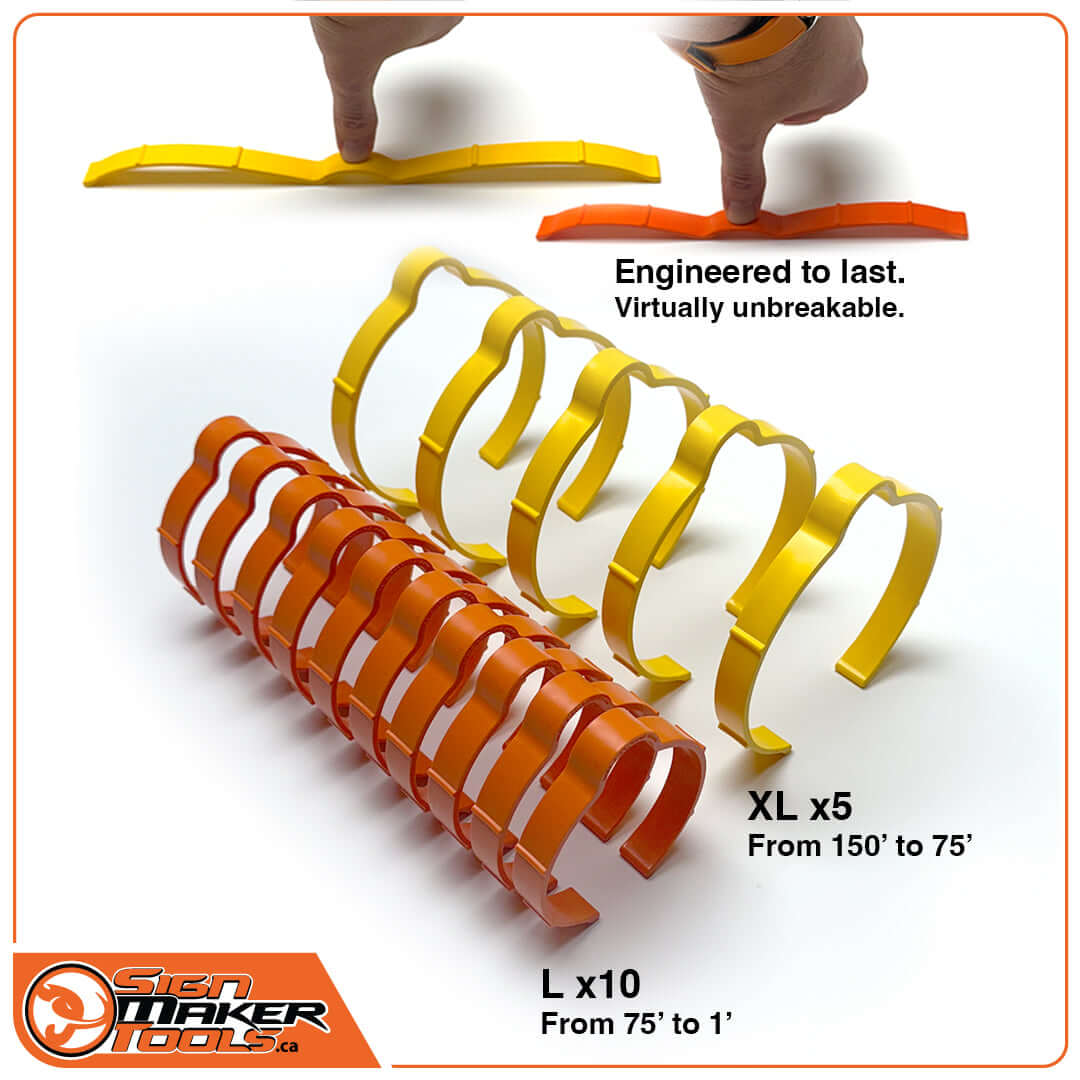 Assorted yellow and orange SpeedClips in XL and L sizes for vinyl rolls, showing flexibility and durability